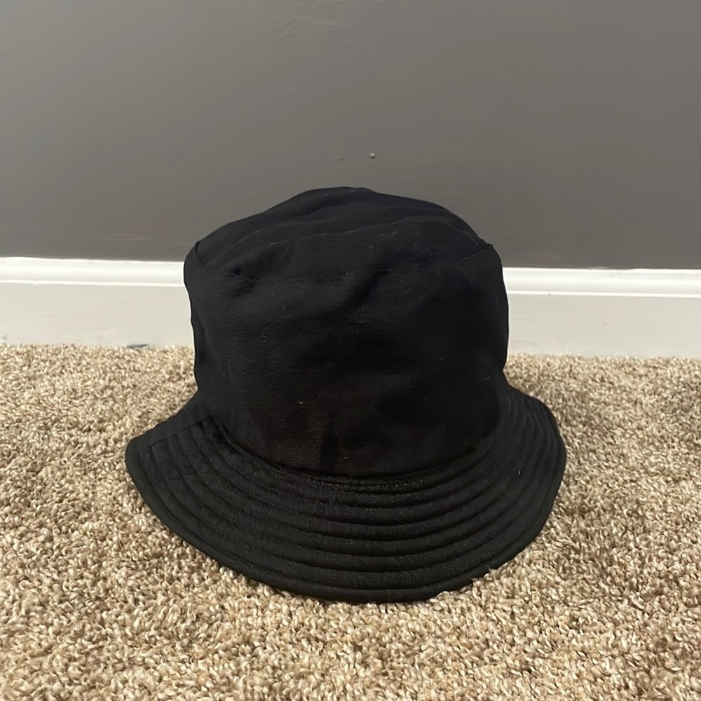 A reversible, black and yellow bucket hat